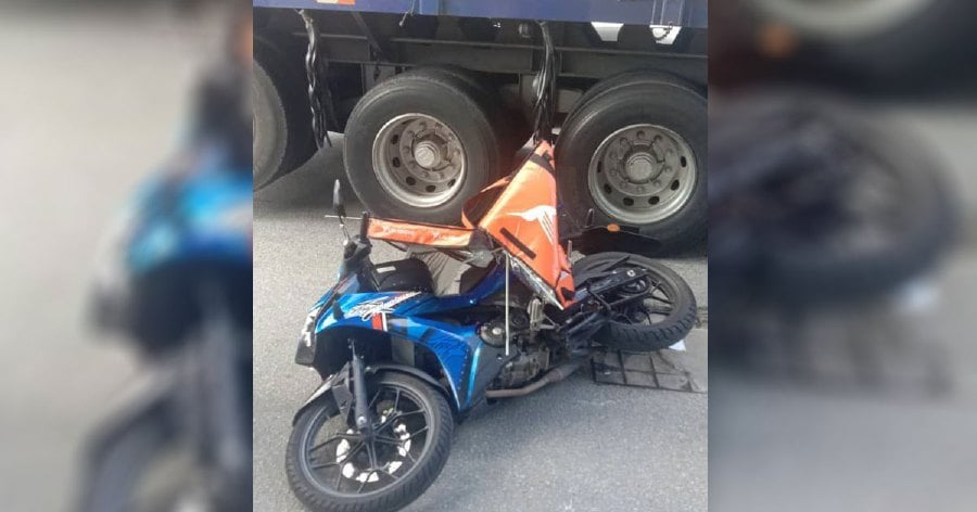 A 23-year-old motorcyclist was killed when her motorcycle skidded into the path of an oncoming trailer at the Simpang 3, Tebrau Industrial Park. - Pic courtesy of Fire and Rescue Department.