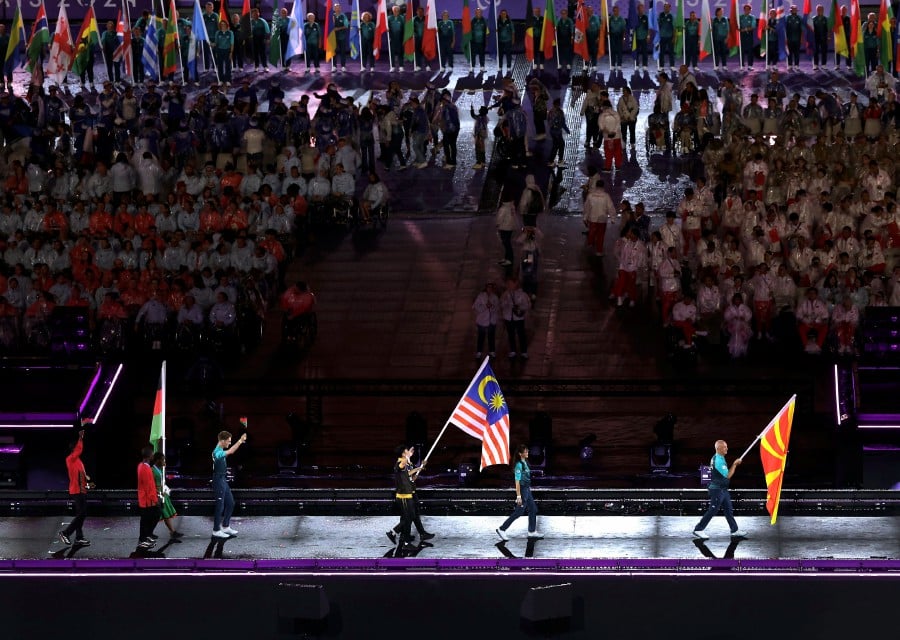 The Jalur Gemilang waved proudly during the official closing ceremony of the Paris 2024 Paralympic Games. - BERNAMA PIC