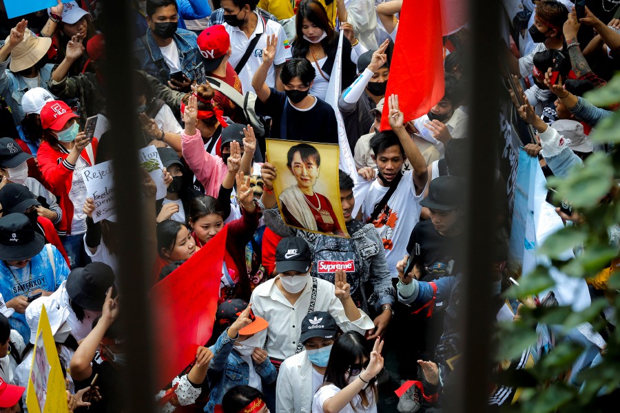  Protesters flash the three finger salute while holding pictures of Myanmar democracy icon Aung San Suu Kyi during a demonstration to mark the second anniversary of Myanmar's 2021 military coup, outside the Embassy of Myanmar, in Bangkok, Thailand. - EPA PIC