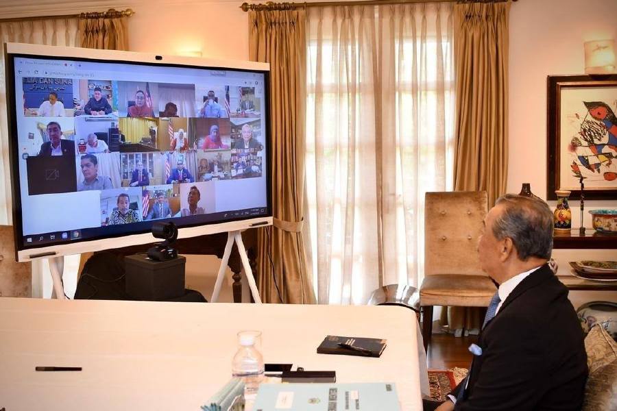  Prime Minister Tan Sri Muhyiddin Yassin speaks to his cabinet members via a video conference. - Pic source: Facebook/ts.muhyiddin