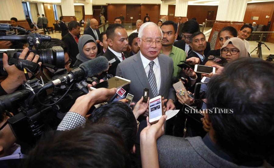 Datuk Sri Najib Razak speaks to reporters at the Parliament lobby in Kuala Lumpur. -NSTP/Saifullizan Tamadi.