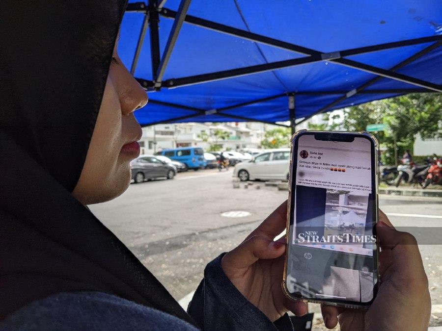 A RM1 nasi lemak seller in Persiaran Paya Terubong, Bukit Jambul, is upset at being linked to the recent viral Sungai Ara chicken rice stall owner who had operated without halal certification. - NSTP/ZUHAINY ZULKIFFLI