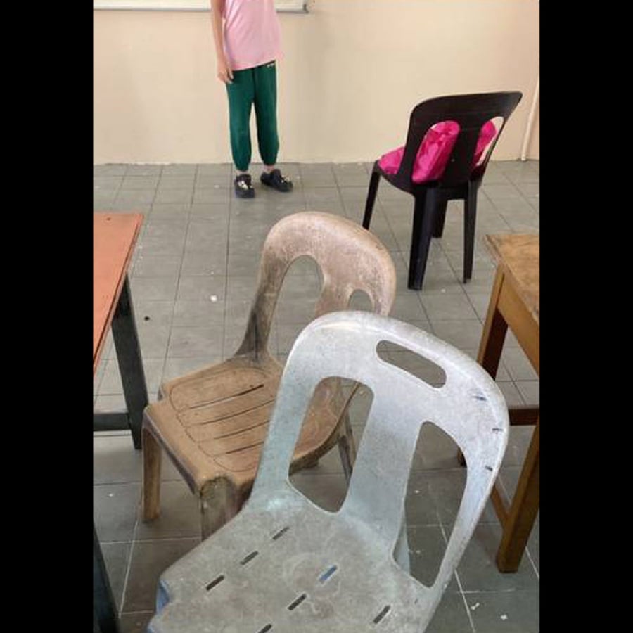 A group of parents banding together to buy plastic chairs for their children at school has gone viral. 