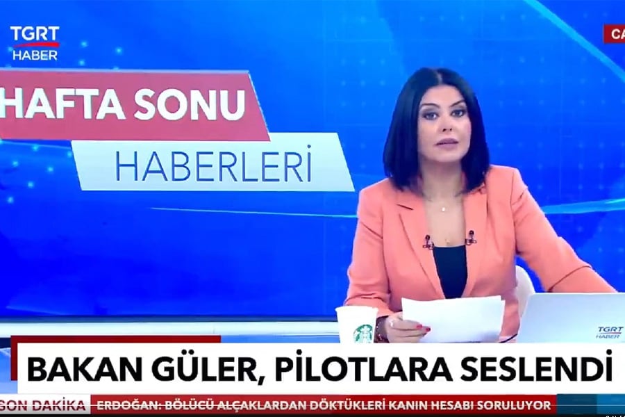 A Turkish news presenter has been fired after she appeared on a live news broadcast with a Starbucks coffee cup on her desk. - Screengrab from X