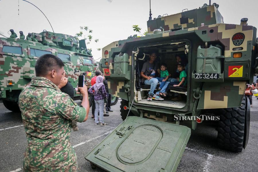 KUALA LUMPUR: Visitors looking at Army assets on display at the Madani government's One-Year Anniversary Programme in Bukit Jalil National Stadium. - NSTP/ASYRAF HAMZAH