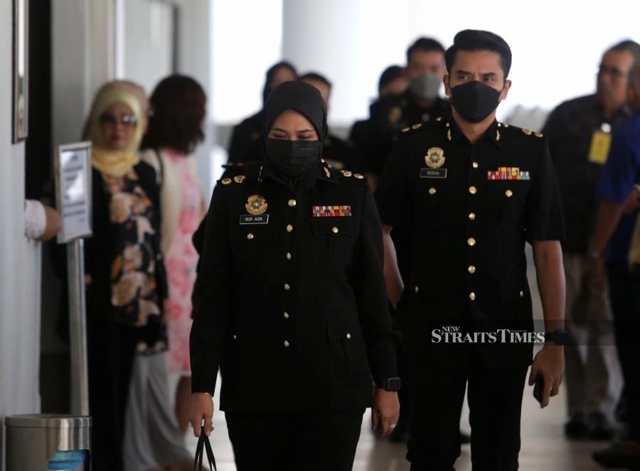 Witness Nur Aida Ariffin enters the court ahead of the trial. -NSTP/MOHAMAD SHAHRIL BADRI SAALI