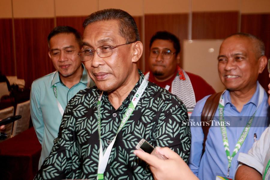 Pas secretary-general Datuk Seri Takiyuddin Hassan speaks to reporters at the party’s 69th Muktamar (General Assembly) at the Ideal Convention Centre (IDCC) in Shah Alam. -NSTP/FAIZ ANUAR