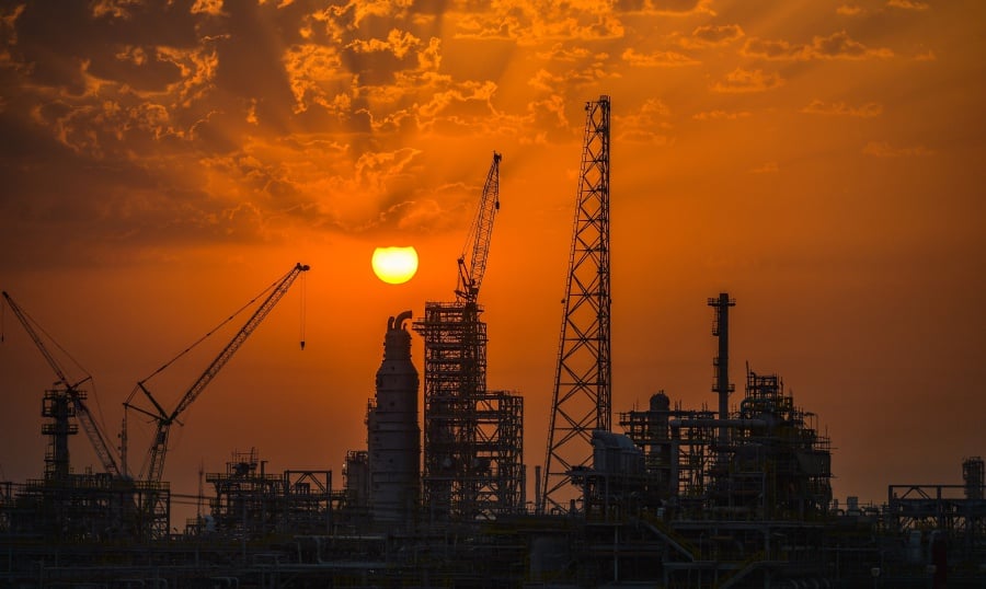The sun rises above underconstruction oil installations and oil refineries, south of Kuwait City, Kuwait, 28 July 2017 . Picture by EPA.RAED QUTENA