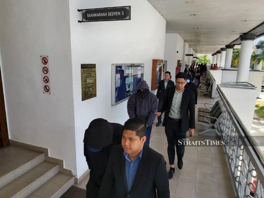 Ong Seng Aun, Hoo Sui Bok and Ooi Liang Sheng seen arriving at the Alor Star Sessions Court ahead of the trial. - NSTP/AHMAD MUKHSEIN MUKHTAR