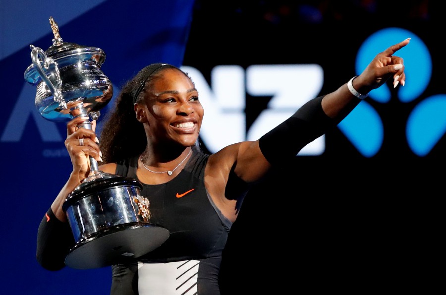  Serena Williams holds her trophy after defeating her sister Venus during the women's singles final at the Australian Open tennis championships in Melbourne, Australia, Saturday, Jan 28, 2017. - AP PIC