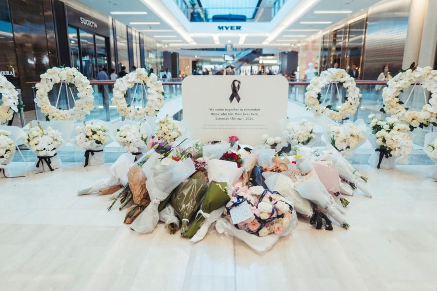 Flowers are seen at a memorial set up inside the Westfield Bondi Junction shopping centre as part of the community’s reflection day in Bondi, Sydney, Australia. - REUTERS PIC