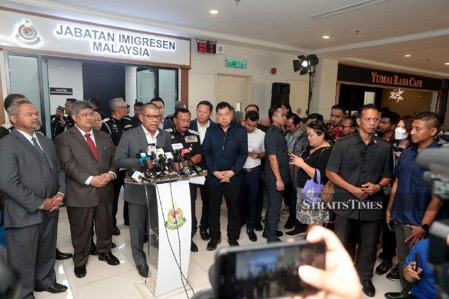 Home Minister Datuk Seri Saifuddin Nasution Ismail speaking to reporters after officiating the opening of the Shaftbury Passport Office at Menara Shaftbury. -NSTP/MOHD FADLI HAMZAH