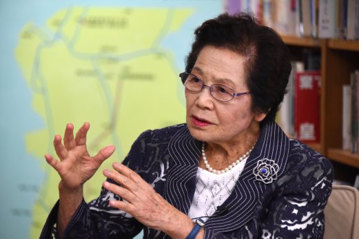  Yoshiko Shimabukuro, survivor among some 222 students and 18 teachers of the "Himeyuri students corps" battlefield nursing unit formed for the Japanese Imperial Army, gestures as she recalls her wartime experience during an exclusive interview with AFP at the Himeyuri Peace Museum in Itoman, Okinawa prefecture, on June 19, 2015. Seventy years after the Battle of Okinawa, Yoshiko Shimabukuro still has terrifying nightmares of watching friends and Japanese soldiers die as they hid in caves to escape fierce American shelling.  AFP PHOTO 