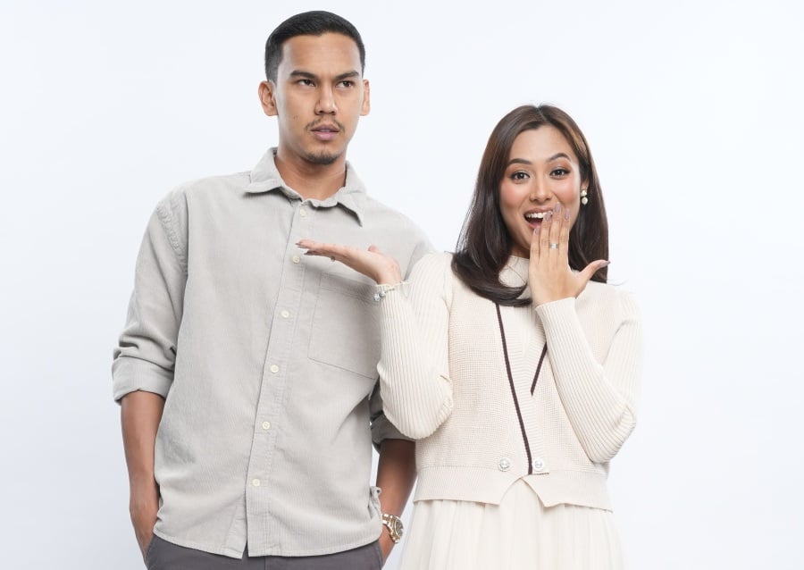Rapper Muhammad Hairi Amin Hamdan, better known as MK of K-Clique (left), and Ezzanie Jasny star in the drama series ‘I Love You, Stupid’, airing on TV3. – Pic courtesy of TV3