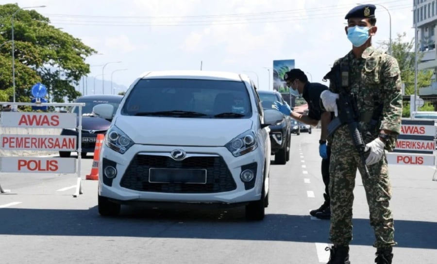 A 27-year-old man without a driving licence hit a police barricade during a roadblock at Kolombong near Kota Kinabalu. – Bernama pic