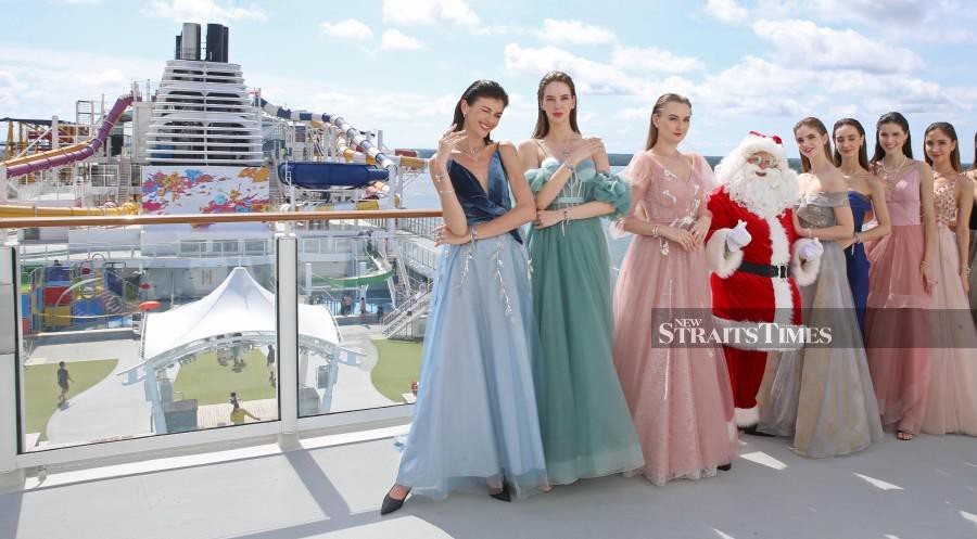 Models in Pandora’s holiday collection onboard the Genting Dream.