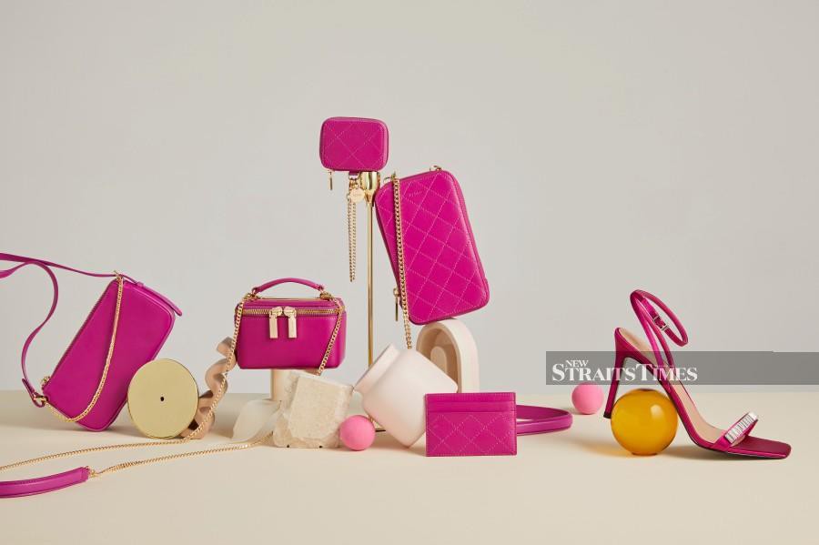 Pedro’s fuchsia accessories adds instant brightness to your ensemble.