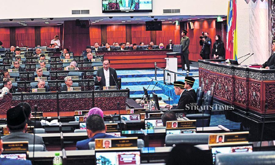  Prime Minister Datuk Seri Anwar Ibrahim tabling the mini budget in Parliament on Dec 20. - Pic courtesy of the Information Department