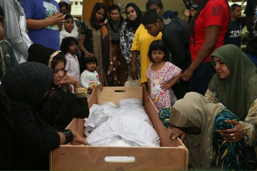 Zakeer Zubir and his 1-year-old daughter was killed in the bus crash along with 12 others. Pix by SHAHNAZ FAZLIE SHAHRIZAL. 