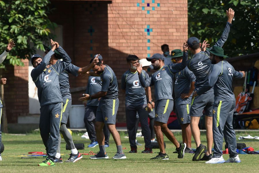 Pakistan cricketers warm up during a team practice session at the City Cricket Association (ACCA) ground in Lahore on October 11, 2021 ahead of the ICC men's Twenty20 cricket World Cup. - AFP PIC