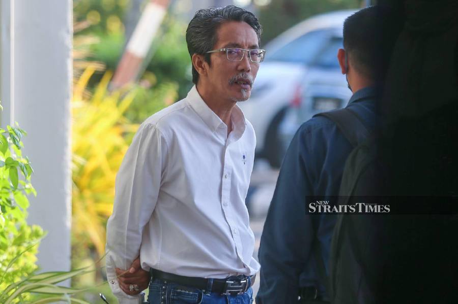  Amran Peaid arrives at the Butterworth Sessions Court ahead of the trial in Penang. -NSTP/DANIAL SAAD