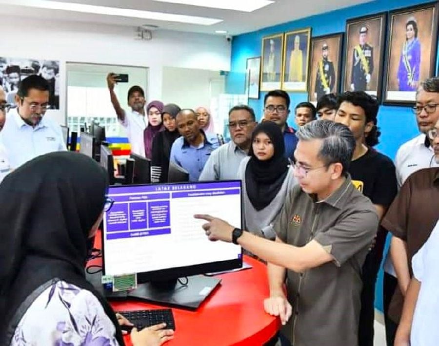 Communications and Digital Minister Fahmi Fadzil meeting users of the Kampung Sungai Tiram PEDi in Johor during a visit in March.