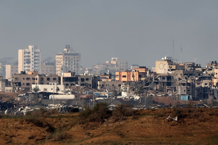 A picture taken from a position in southern Israel on the border with the Gaza Strip on January 2, 2024, shows destroyed buildings in northern Gaza following Israeli bombardment amid ongoing battles between Israel and Hamas. - AFP PIC