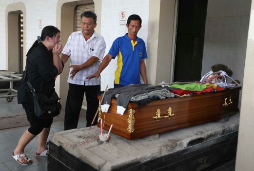 Penang quadruple murder: Families battle tears as killer's ...