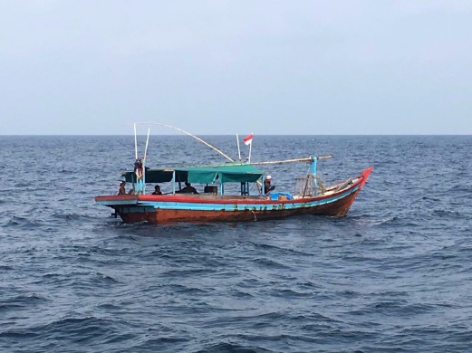 An Indonesian boat with four fishermen was caught encroaching into Malaysian waters about 40 nautical miles southwest of Penang yesterday. Pic courtesy of MMEA 
