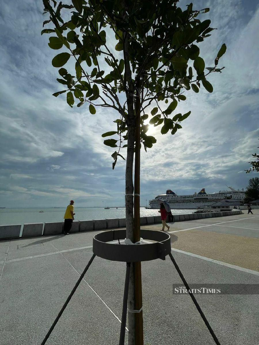 The Penang Esplanade lower walkway of the seawall is temporarily closed after it was opened on Friday due to the high tide phenomenon. - Pic by Marina Emmanuel
