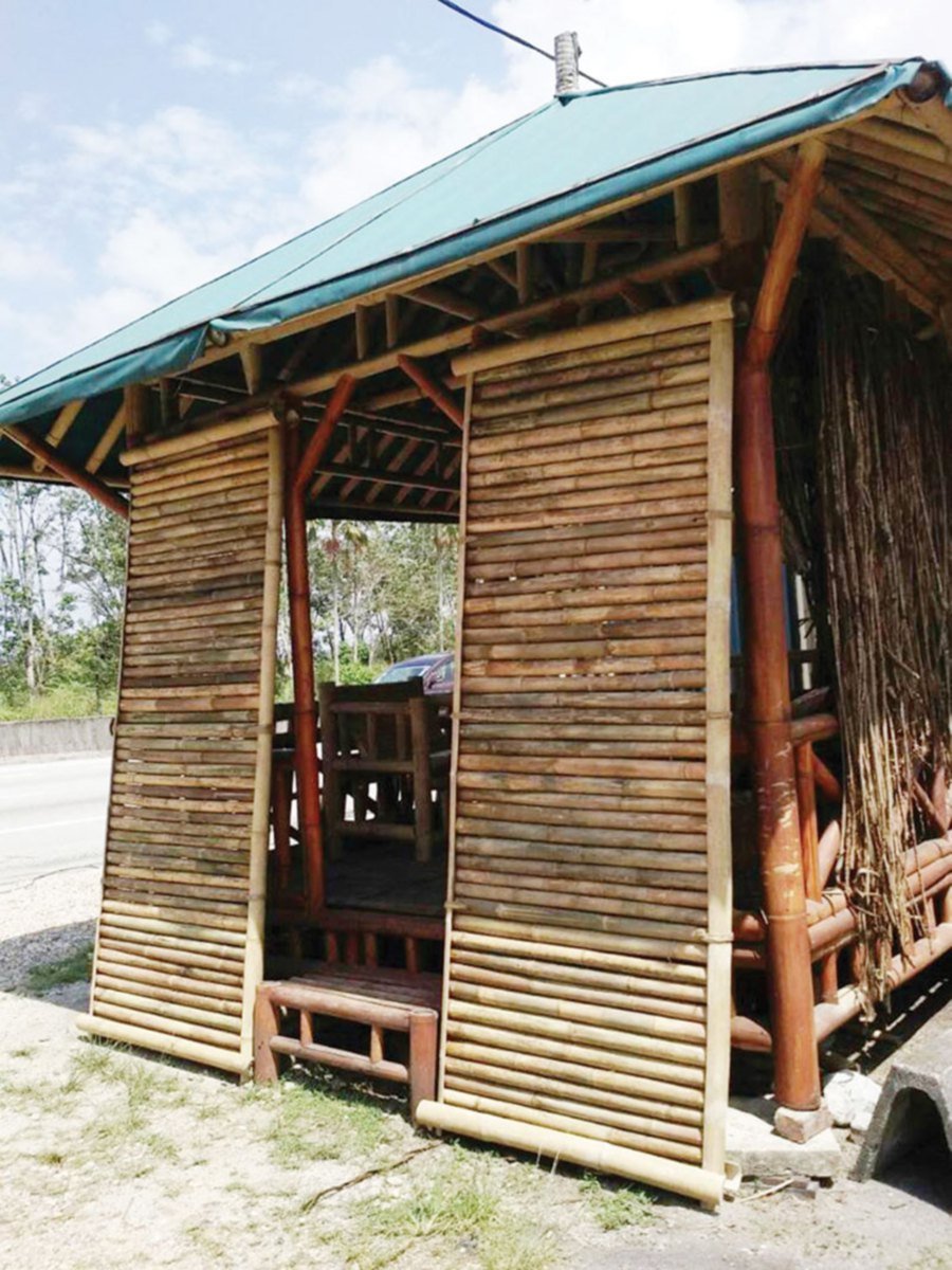 A gazebo with bamboo walls for shade.