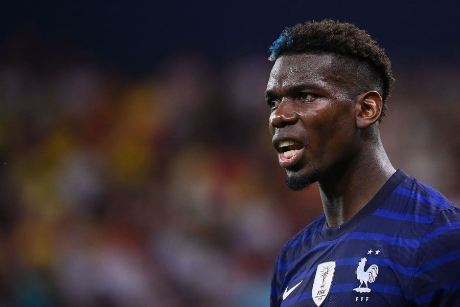 France star Paul Pogba has been given a four-year ban from football by Italy's anti-doping tribunal after testing positive for testosterone last August, his club Juventus said on February 29, 2024. - AFP PIC