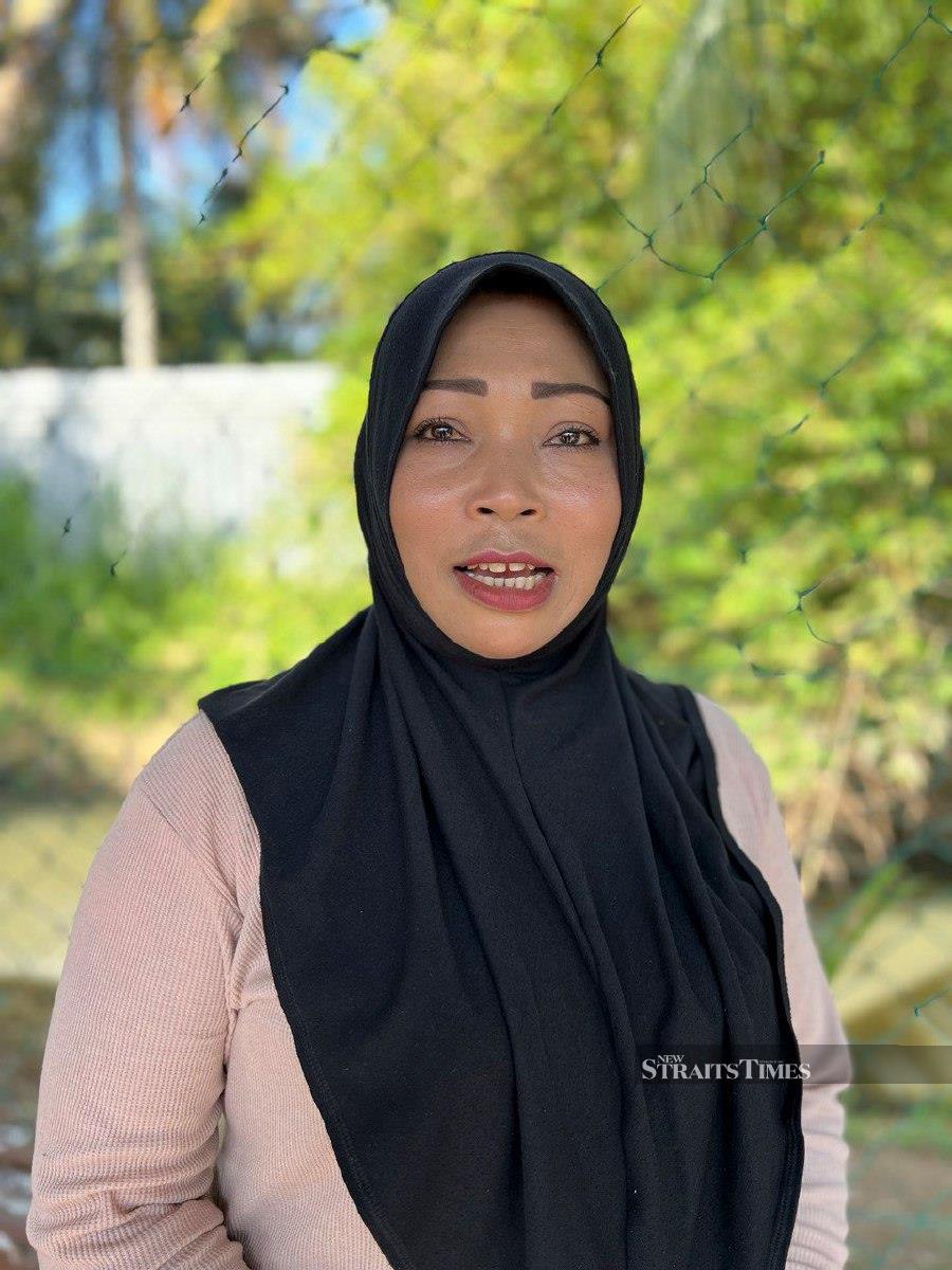 Siti Aishah Mat Isa, 45, welcomes Berangan Aqua Park move to offer an alternative for Muslim women to enjoy time in a waterpark. -- NSTP/ADIE ZULKIFLI