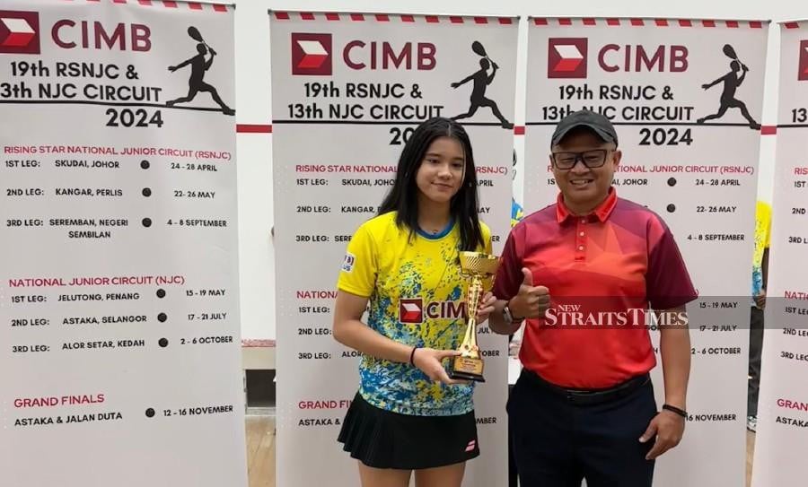 Harleein Tan (left) poses with trophy after winning the girls’ Under-19 title at the CIMB National Junior Circuit in Penang on Sunday. - Pic courtesy of CIMB National Junior Circuit