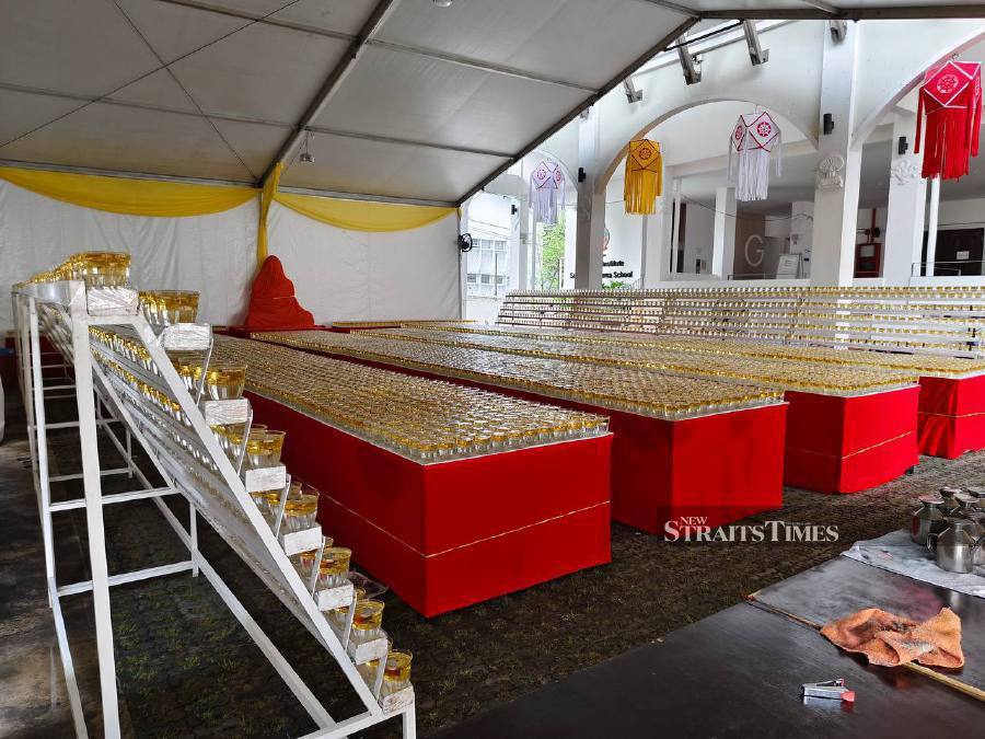 Candles prepared for devotees ahead of the celebration. - NSTP/Hadi Solehim