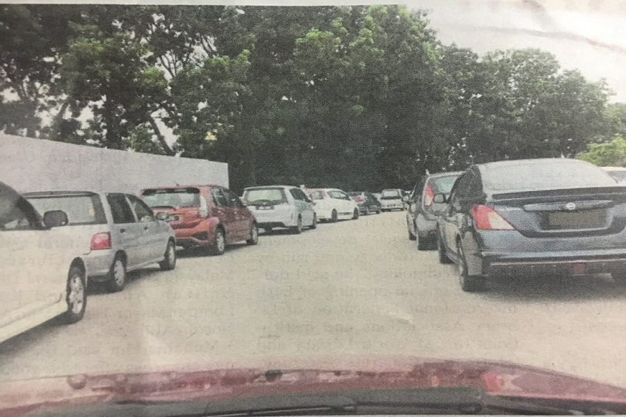 Visitors often double-park at Putrajaya Hospital due to a lack of parking space. Pix courtesty of NST reader
