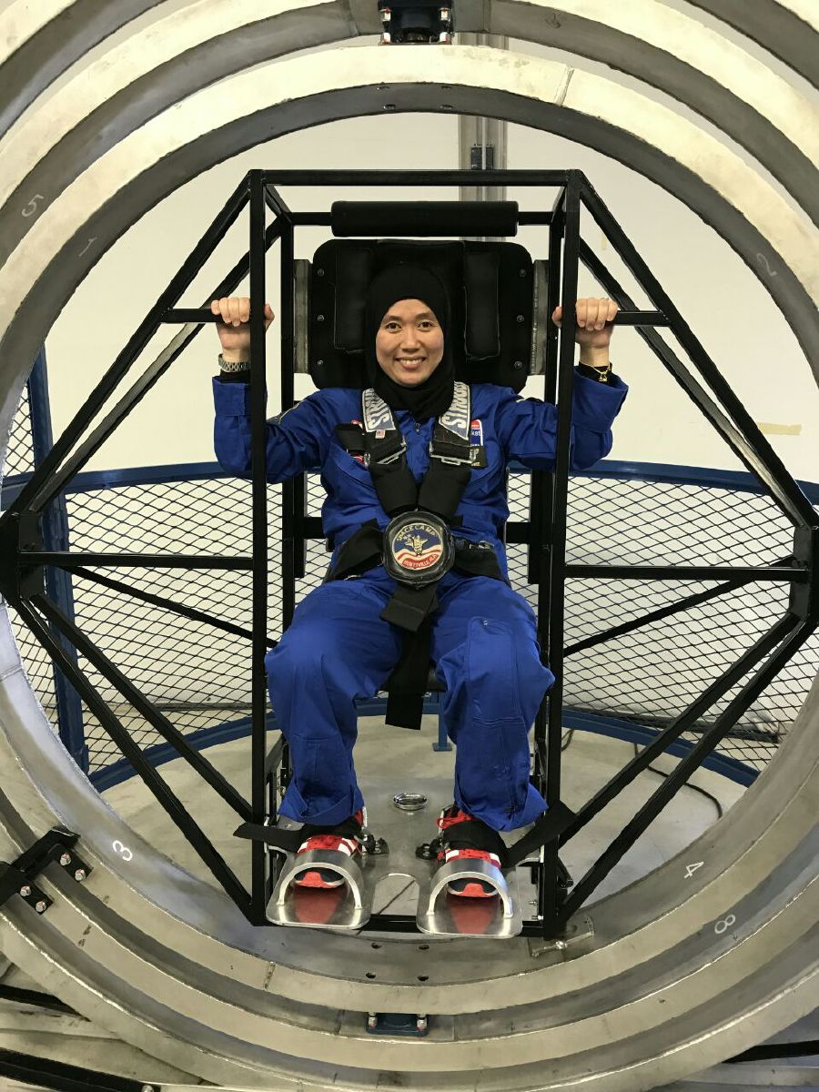 Suwiti Abd Ranee participating in a space training simulator at the USSRC.
