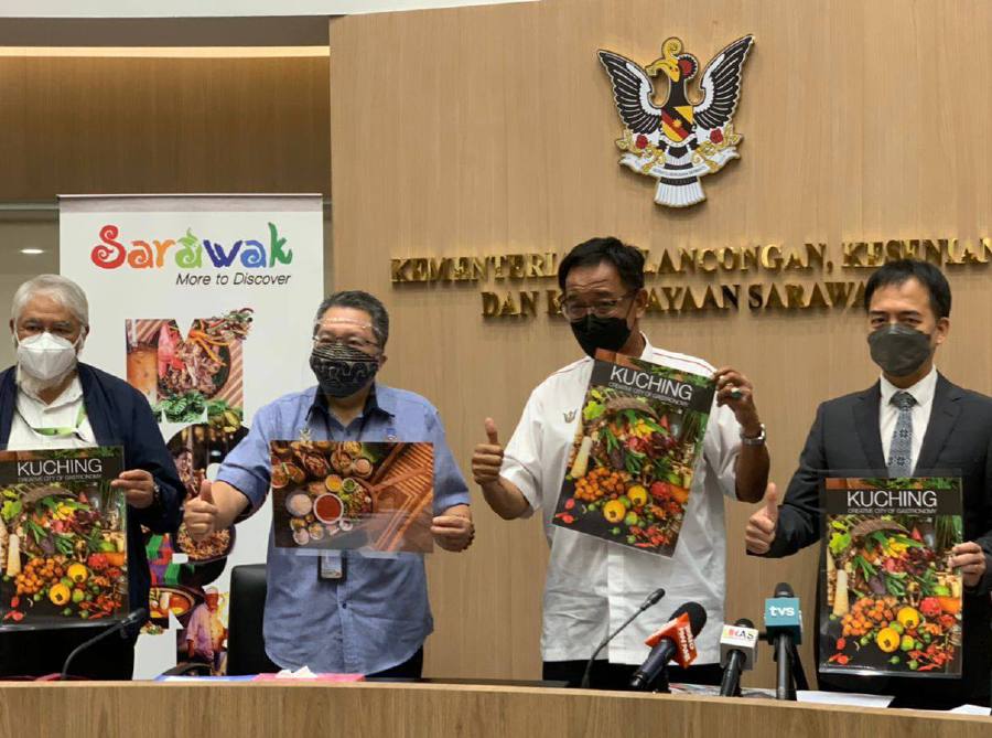 Sarawak Tourism, Arts and Culture Minister Datuk Abdul Karim Rahman Hamzah (second right) announces that Kuching city is now a new member of Unesco Creative Cities Network (UCCN), together with MBKS Mayor (third right) Wee Hong Seng. - Courtesy pic Sarawak Tourism