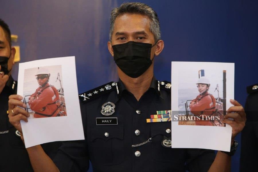 State police chief Datuk Mohd Shuhaily Mohd Zain showing the photographs used by the suspect to dupe victims. -- NSTP/MIKAIL ONG