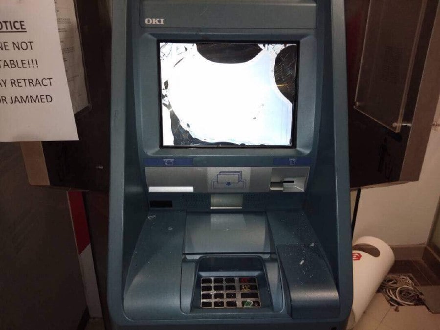 A man in Sibu became enraged when the ATM suddenly malfunctioned as he tried to withdraw money. Pix by Harun Yahya