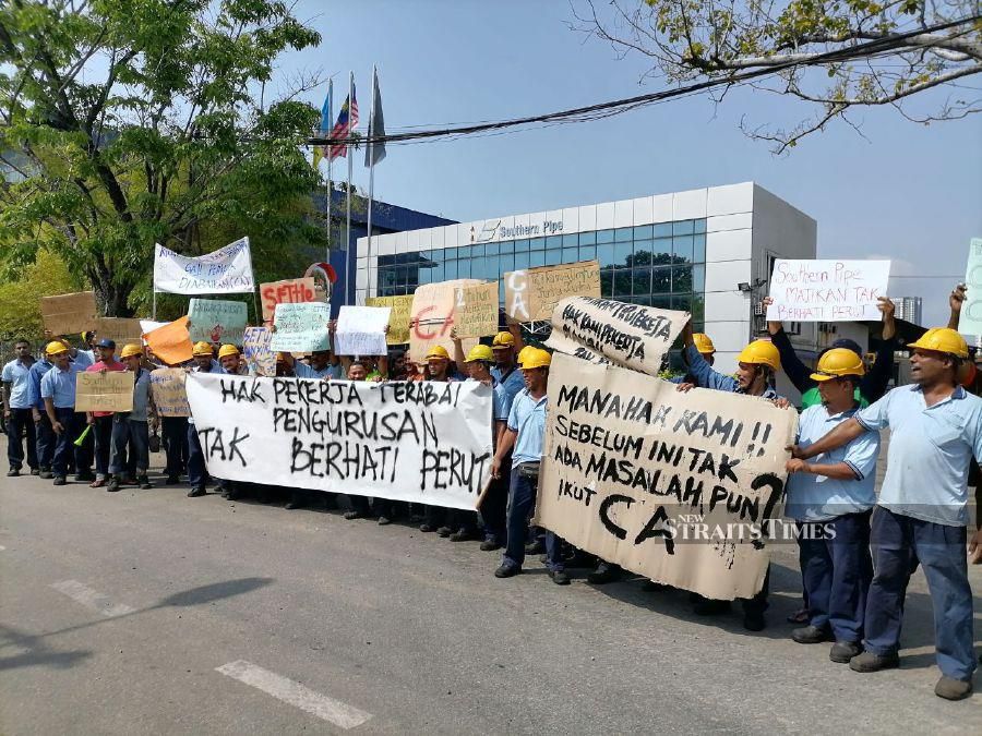Employees of a steel factory at Jalan Chain Ferry here are demanding that their employer resolves their salary adjustment issue. -NSTP/ZUHAINY ZULKIFLI