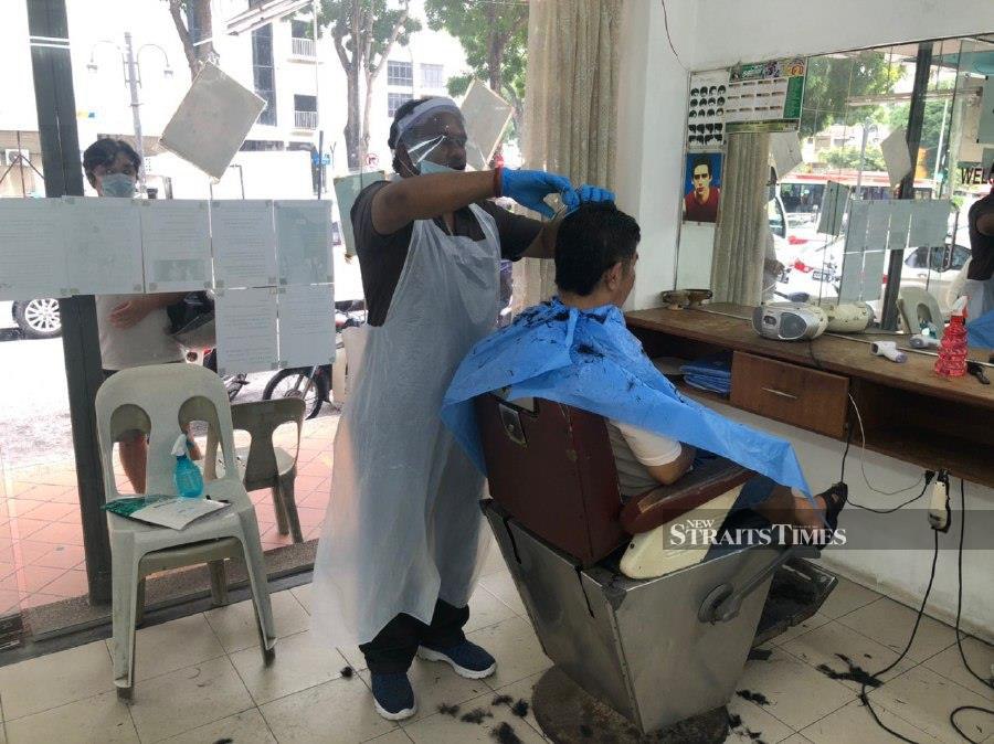 Steady Stream Of Customers At Barbershops As Business Resumes