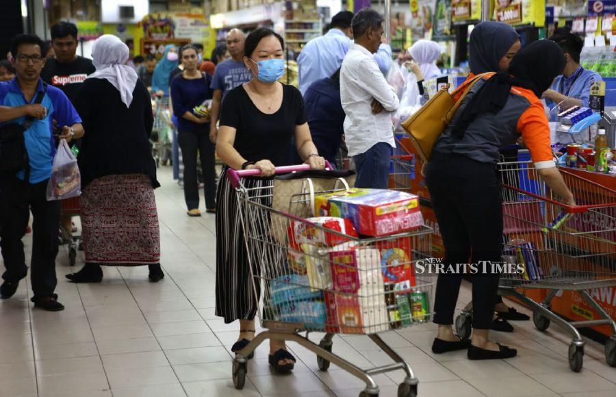 People engaging in panic buying prior to the Prime Minister's announcement of a restricted movement order to be imposed for two weeks effective March 18. - NSTP/ NADIM BOKHARI