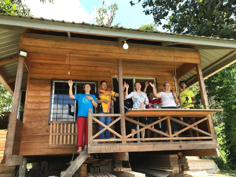 Villagers of Kampung Long Pasia in Sipitang, gathered at their respective houses for a 'remote' Easter Sunday mass at 9am today. - Pic courtesy of Lait Lakong