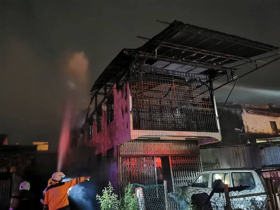  Firefighters today rescued an octogenarian man from his double-storey terrace house in Sungai Bakap, here, today (Saturday). - Pic courtesy of Fire and Rescue Department