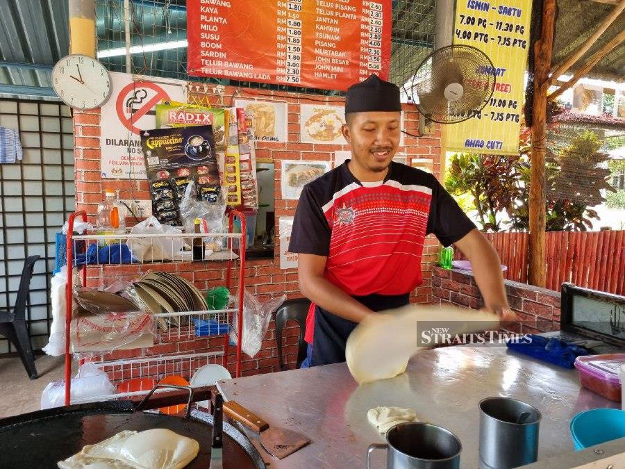 Pasir Mas trader keeps to RM1 roti canai, but admits hike imminent ...