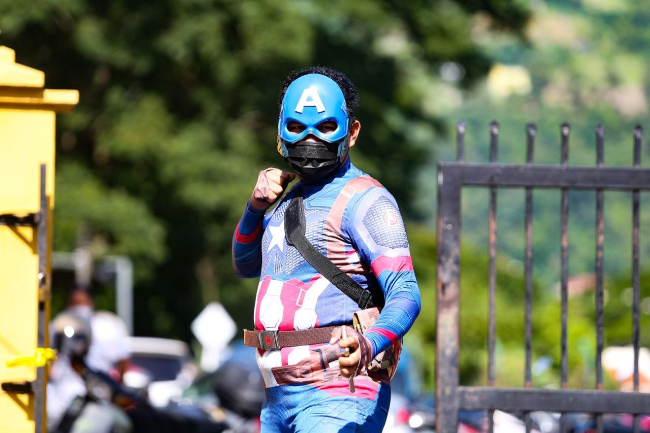 All eyes were on Muhamad Shahrizal Mat Sahat, 35, when he walked into Sekolah Kebangsaan (SK) Sri Aman in Air Itam here to cast his vote in a Captain America costume. - NSTP/MIKAIL ONG.