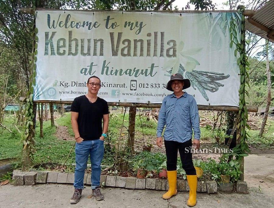 Borneo Vanilla founder Leo Komuji (right) and Business Development Director Richie Lee (left) at the My Kebun Vanilla at Kinarut near here. - NSTP/Olivia Miwil