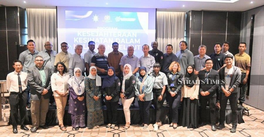 Dr Vanitha Subramaniam (third from left) with seafarers in the Health Well-being Program Among Seafarers under the Healthy Malaysia National Agenda (ANMS) organized by the Ministry of Health (KKM) recently. - NSTP/Samadi Ahmad