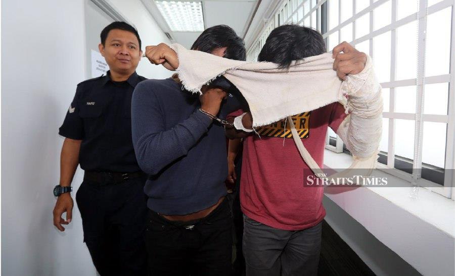 Mohamad Hafiz Naharoddin, 28, and Ahmad Fazrin Naharoddin, 31, however pleaded not guilty when the charges were read to them before Judge Ainon Shahrin Mohamad. - NSTP/L. MANIMARAN